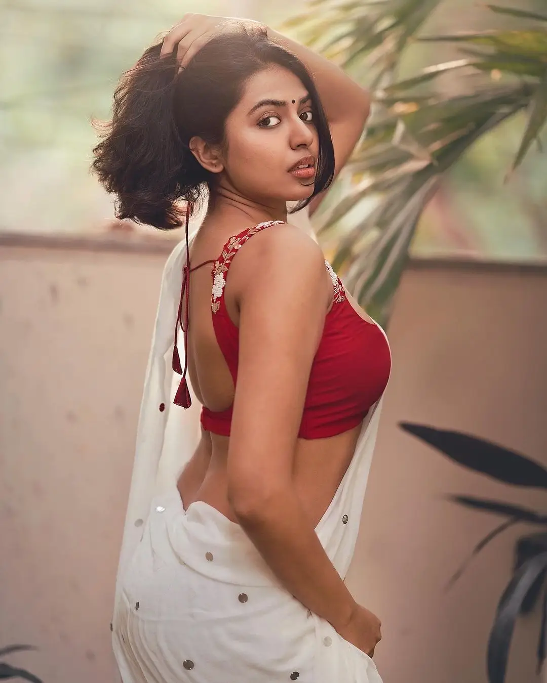 actress shivani rajashekar in white saree sleeveless red blouse